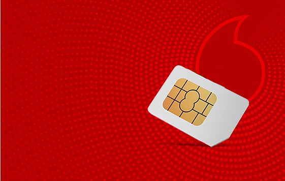 A sim card placed on a vibrant red background.